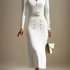 A fitted white V-neck midi dress with long sleeves, a decorative belt, and gold button accents.