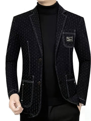 A black denim blazer with white contrast stitching, a lapel collar, and a chest pocket.