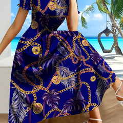 A vibrant blue A-line dress featuring a tropical chain and palm leaf print with short sleeves.