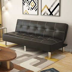A black leather sofa bed with white stitching and silver legs in a modern living room.