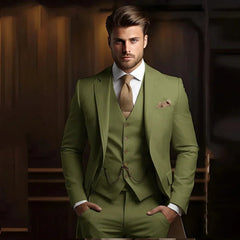 A man wears a slim-fit, three-piece khaki suit with a matching vest and a textured brown tie.
