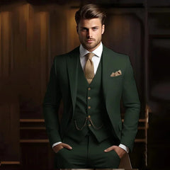 A man wears a slim-fit dark green three-piece suit with a textured gold tie and pocket square.