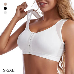 A woman wears a white front-closure sports bra with mesh side panels and wide shoulder straps.