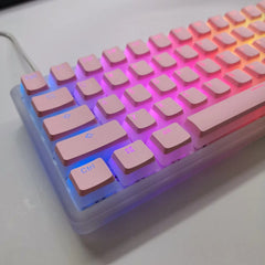 A pink and translucent pudding-style mechanical keyboard with RGB backlighting.