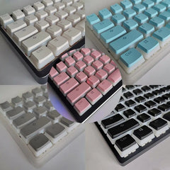 A collage showing mechanical keyboard keycap sets in white, blue, pink, grey, and black colors.
