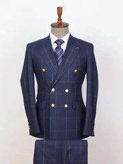 A navy blue double-breasted plaid suit with gold buttons, including a blazer and matching trousers.