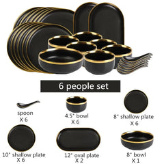 A six-person black ceramic dinnerware set with gold rims, including plates, bowls, and spoons.