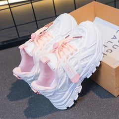 A pair of white mesh platform sneakers for girls with pink laces and a Jintu tag.