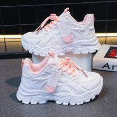 A pair of white and pink mesh platform sneakers for girls with lace-up closures.