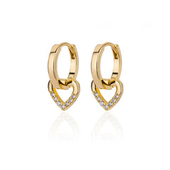 A pair of gold-colored stainless steel hoop earrings featuring dangling heart-shaped charms with zircon accents.