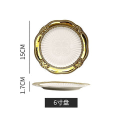 A white ceramic plate with a decorative gold rim and a 15 centimeter diameter.