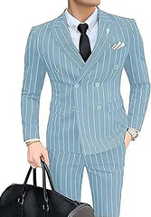 A man wears a light grey double-breasted suit with white vertical stripes and a black tie.