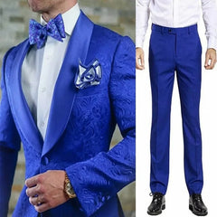 A two-piece royal blue suit featuring a patterned jacket with a satin shawl lapel and matching trousers.