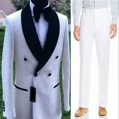 A white patterned double-breasted tuxedo jacket with a black shawl lapel paired with white pants.
