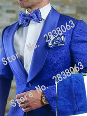 A man wears a royal blue patterned two-piece tuxedo with a shawl satin lapel and matching bow tie.