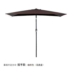 A brown half-shaped outdoor patio umbrella with a hand-crank mechanism, designed to stand against a wall.