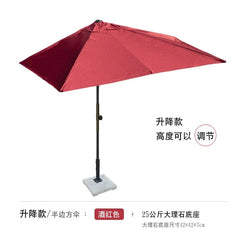 A wine red half-square outdoor patio umbrella with an adjustable pole and a square stone base.