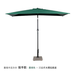 A dark green half-square patio umbrella with a hand-crank mechanism and a stone base.