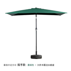 A dark green half-square patio umbrella with a hand-crank mechanism and a semi-circular base.