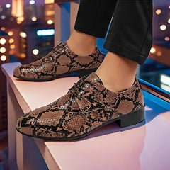 A pair of brown and black snake-patterned lace-up oxford shoes with a low heel.