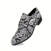 A gray and black snake-patterned oxford shoe with a pointed toe and lace-up closure.