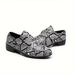 A pair of gray and black snake-patterned lace-up oxford shoes with a low heel.