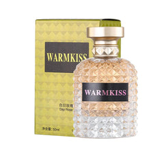 A 50ml bottle of Warmkiss Day Rose perfume with a textured glass design and a gold cap.