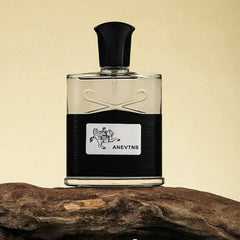 A rectangular glass perfume bottle with a black base and a label featuring a horse rider graphic.