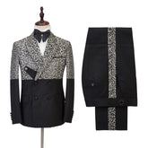 A two-piece men's suit featuring a double-breasted jacket with a leopard print upper and black trousers with a matching side stripe.