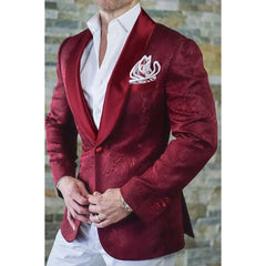 A slim-fit burgundy jacquard blazer with a satin shawl lapel and a white pocket square.