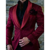 A slim-fit burgundy jacquard blazer for men featuring a contrasting shawl lapel.
