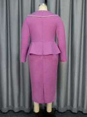 A back view of a long-sleeved purple sheath dress featuring a peplum waist and beaded neckline.