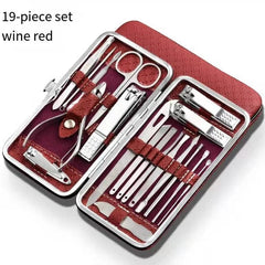 A 19-piece stainless steel manicure set in a wine red leather carrying case.