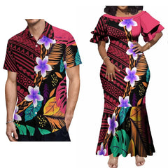 A man and woman wearing matching outfits with a black, red, and floral Polynesian tribal print.