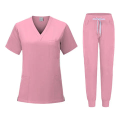 A pink women's scrub set featuring a V-neck top with pockets and matching jogger-style pants.