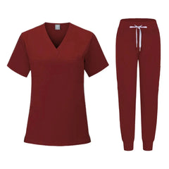A dark red women's scrub set featuring a V-neck top and matching jogger-style pants.