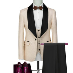 A cream patterned tuxedo jacket with a black shawl lapel, matching vest, and black trousers.