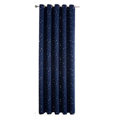 A navy blue blackout curtain panel featuring a white star pattern and a grommet top.