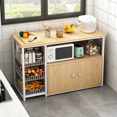 A wooden kitchen storage rack with a microwave shelf, cabinet, and three wire produce baskets.