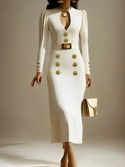 A woman wears a cream-colored, long-sleeved midi dress with gold buttons and a belted waist.