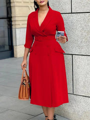 A woman wears a red midi-length office dress with a V-neck, three-quarter sleeves, and a sash belt.