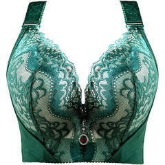 A green lace push-up bra with adjustable straps and a small heart-shaped charm at the center.