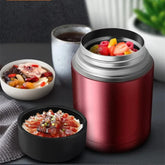 A rose red stainless steel vacuum insulated food jar shown with its lid and various meals.