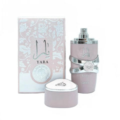 A bottle of Lattafa Yara eau de parfum for women with its matching light pink floral box.