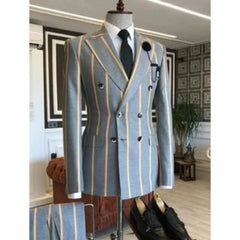 A light blue double-breasted men's suit with wide vertical stripes and a peaked lapel.
