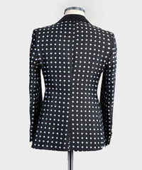 A black slim-fit men's tuxedo jacket featuring a white polka dot pattern and a shawl lapel.