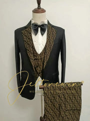 A three-piece black suit featuring a patterned vest and matching trousers with a shawl lapel.