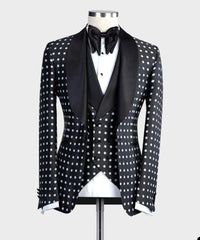 A black three-piece tuxedo featuring a white polka dot pattern and a black shawl lapel.