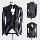 A three-piece black suit with white polka dots featuring a shawl lapel and a matching bow tie.