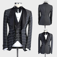 A three-piece black suit with white polka dots featuring a shawl lapel and a matching bow tie.
